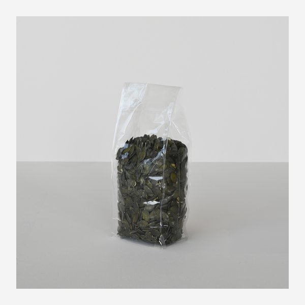 Flat bottom bag with adhesive stripe, transparent